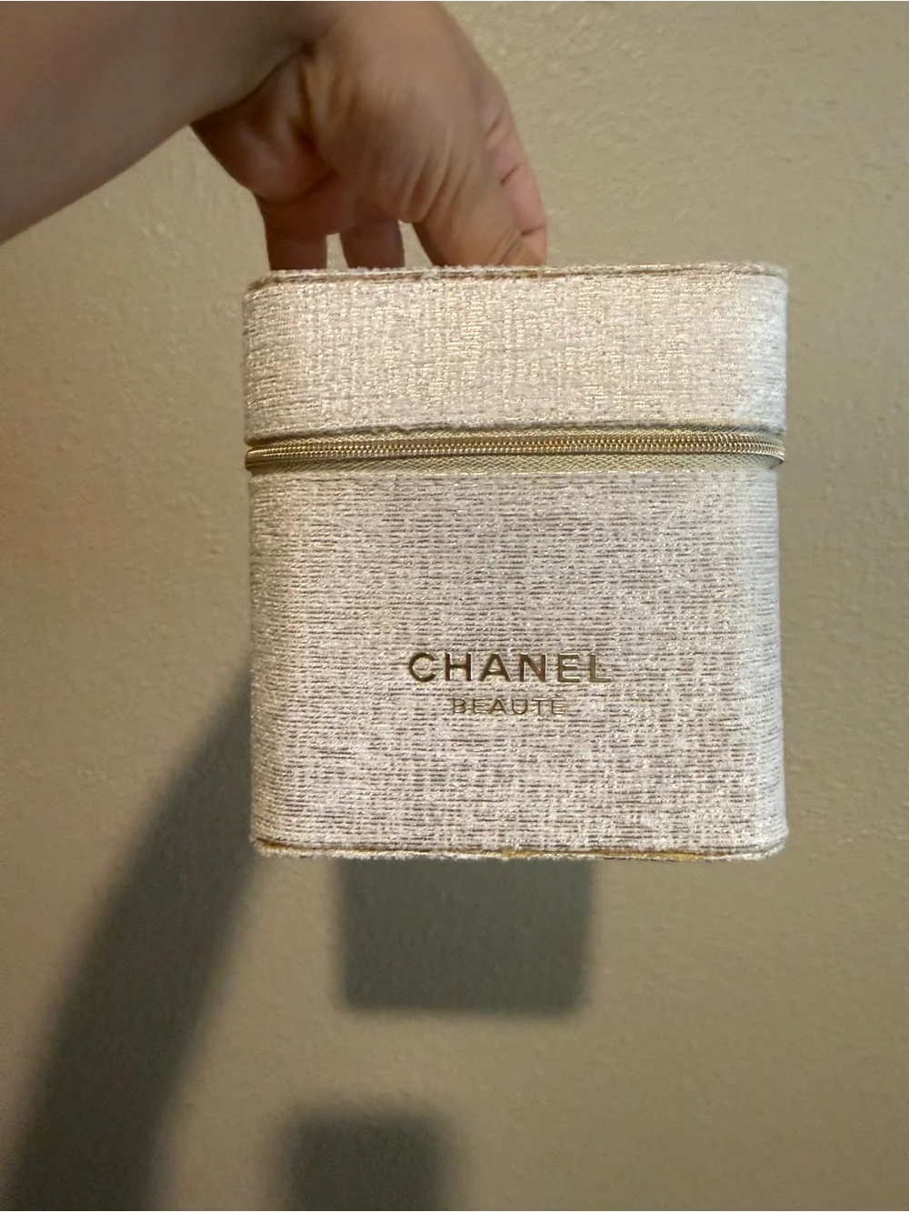 CHANEL Cream Textured Zippered Beauty Case with Gold Accents